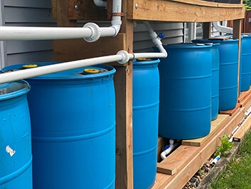 Blue Barrels connected to pipe draining structure